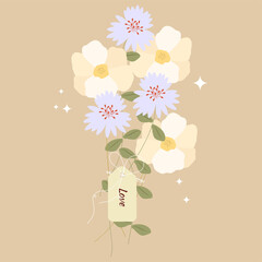 A bouquet of tied wildflowers with a note - LOVE.