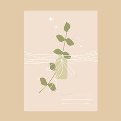 An envelope tied with a thread of kraft paper with a branch of eucalyptus.