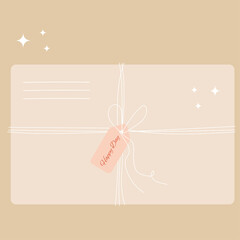 An envelope tied with a thread of kraft paper with a note -Happy day.