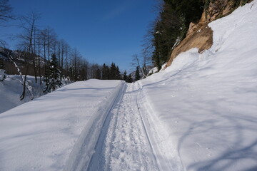Fototapeta na wymiar Snow covered road. Road and vehicle tracks on snow. top of mountain at winter Borçka Turkey.