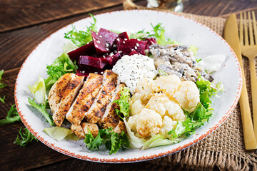 Healthy lunch. Boiled beetroot salad with greens, stewed mushrooms,  and grilled chicken fillet and baked cauliflower. Dinner.