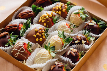 Strawberries covered with chocolate on a gray background