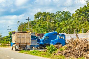 Trucks dump truck excavators and other industrial vehicles Tulum Mexico.