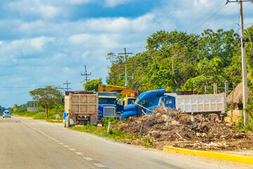 Trucks dump truck excavators and other industrial vehicles Tulum Mexico.