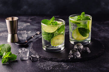 Refreshing summer alcoholic cocktail mojito with ice, fresh mint and lime