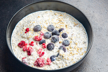 oatmeal porridge chia seeds and berries oat breakfast fresh healthy meal food diet on the table copy space food background keto or paleo diet