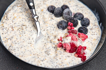 oatmeal porridge chia seeds and berries oat breakfast fresh healthy meal food diet on the table copy space food background keto or paleo diet