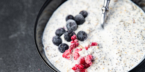 oatmeal porridge chia seeds and berries oat breakfast fresh healthy meal food diet on the table copy space food background keto or paleo diet