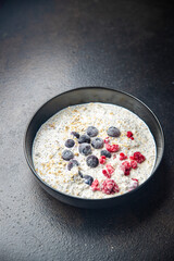 oatmeal porridge chia seeds and berries oat breakfast fresh healthy meal food diet on the table copy space food background keto or paleo diet