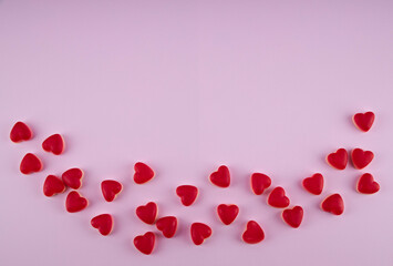 jelly hearts on a pink background, top viev, copy spase