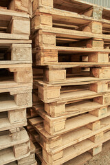 Pile of wooden pallets stacked on top of each other