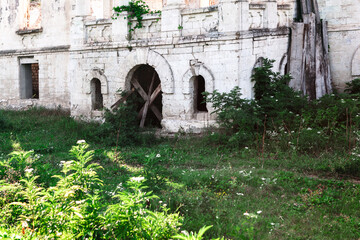 Abandoned building with overgrown area . Old abandoned monastery 