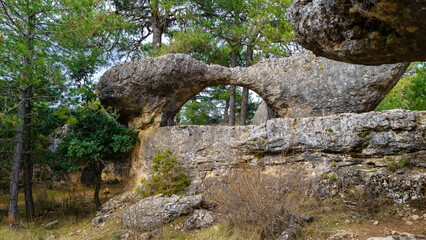 Stone arch in the forest of the Enchanted City, Cuenca, Spain.