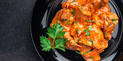 stewed meat tomato sauce pork beef chicken fresh dietary healthy meal food diet snack on the table copy space food background 