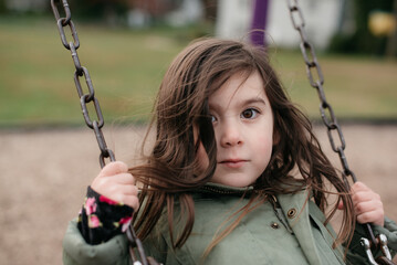 portrait of a girl on a swing