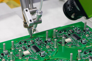 The automatic soldering robot operation with PCB board.