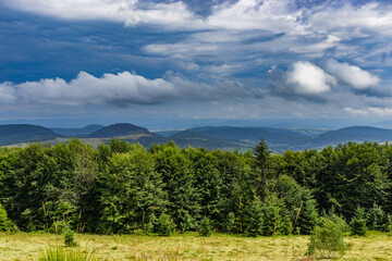 Amazing landscape at the mountain top. Panoramic view at mountain valleys lit by sun. Carpathians, Ukraine