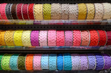 Colorful Ric Rac ribbon on rack in craft shop. Artisan and Handcraft material. DIY hobby Concept