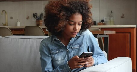 Close up happy African teenage girl holds cell win on-line game, celebrate victory, have fun online, achieve goal, scholarship got, pass exam, successful university admission, read good news concept