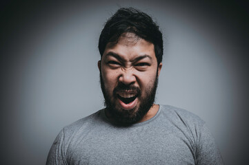 Asian handsome man angry on white background,Portrait of young Stress male concept