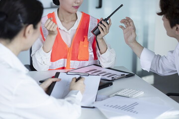 Engineers discussing with walkie talkie