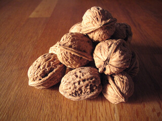 Beautiful walnuts in a pile on table