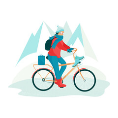 A woman in winter wearing glasses on a bicycle. The girl carries skates, a thermos with food.