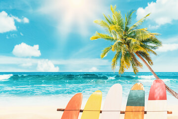 Surfboard and palm tree on beach background.