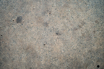 Aged Cement paving walkway with stunning textures and patterns shaping as the years of being used has worn it out
