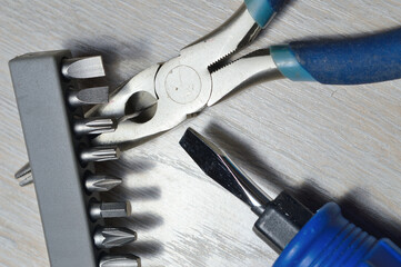 a working tool for minor repairs is laid out on the table