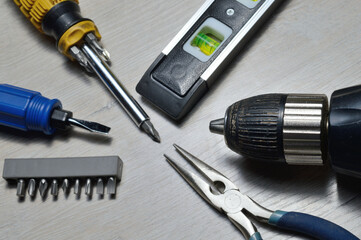a working tool for minor repairs is laid out on the table