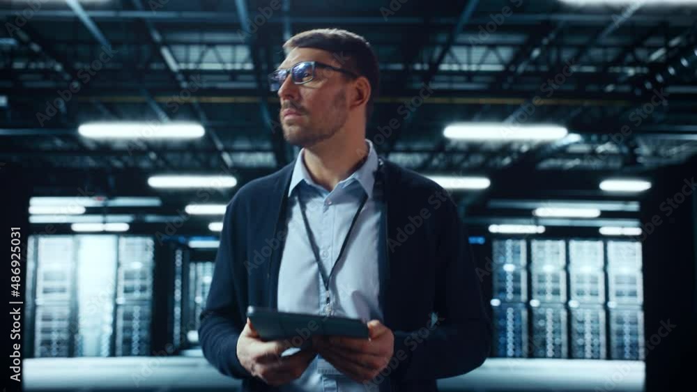 Fototapete Male IT Specialist Walks Between Row of Operational Server Racks in Data Center. Engineer Uses Tablet Computer for Maintenance. Concept for Cloud Computing, Artificial Intelligence, Cybersecurity.
