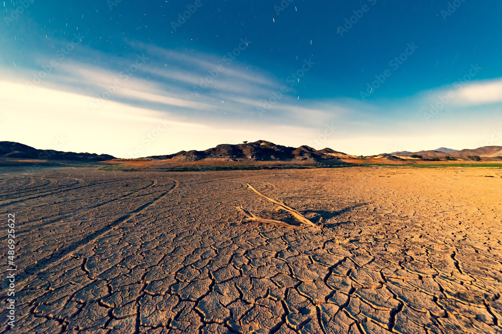 Poster a beautiful shot of dried ground field in sharjah, united arab emirates.