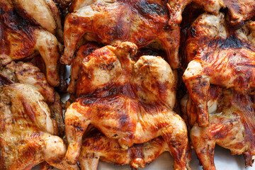 Local street food, delicious charcoal grill whole chicken barbecue in asian thai style.