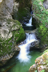 Fototapeta na wymiar Big waterfall in the forest in Slovenia