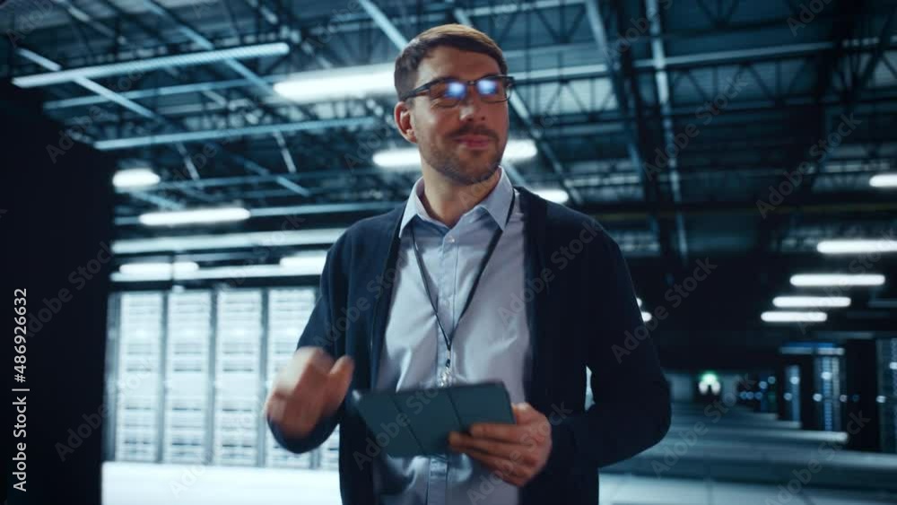 Aufkleber Male IT Specialist Walks Between Row of Operational Server Racks in Data Center. Engineer Uses Tablet Computer for Maintenance and Diagnostics in Cyber Security and Data Protection Facility.