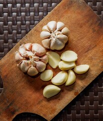 garlic. garlic cloves. peel the garlic clove. Garlic is one of the main spices in Indonesian cuisine