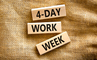 4-day work week symbol. Concept words 4-day work week on wooden blocks on beautiful canvas table, canvas background. Copy space. Business and 4-day work week and short workweek concept.