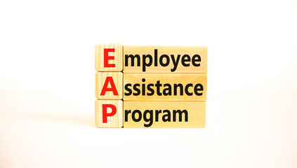 EAP employee assistance program symbol. Concept words EAP employee assistance program on blocks on beautiful white table white background. Business EAP employee assistance program concept. Copy space.