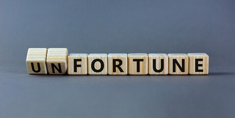 Fortune or unfortune symbol. Turned wooden cubes and changed the concept word unfortune to fortune....