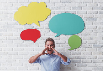 Man with speech bubbles