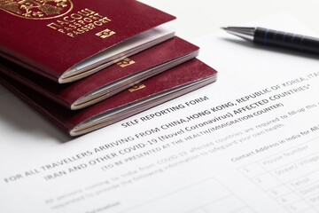 Passports and self reporting form for all travellers