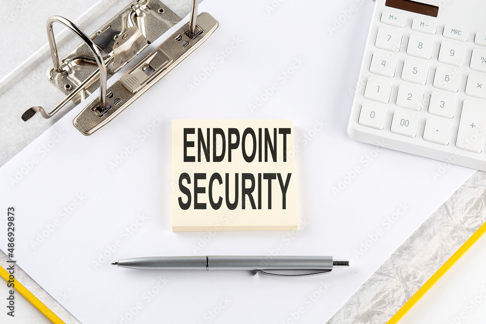 Aufkleber endpoint security - business concept, message on the sticker on folder background with calculator