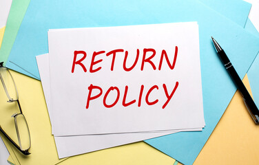 RETURN POLICY text on paper on the colorful paper background