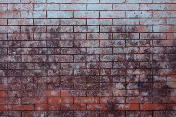 Background of old vintage dirty brick wall with peeling plaster, brick wall texture