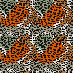 Leopard skin. Seamless pattern with leopard skin. Black spots on a background of brown and gray spots.