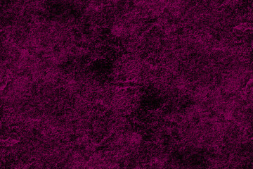 Dark magenta color rough concrete wall surface with scattered heavy grunge texture for background