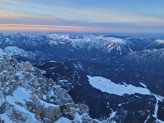 Aerial view on a frozen mountain lake in the alps. View from the top of germany.