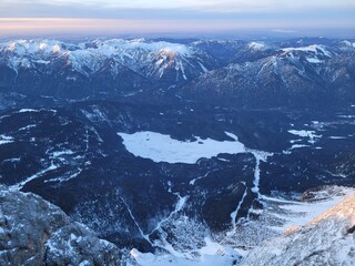 Aerial view on a frozen mountain lake in the alps. View from the top of germany.