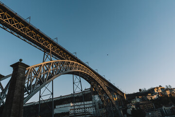Views of the Don Luis bridge from below at sunset, in Porto Portugal.